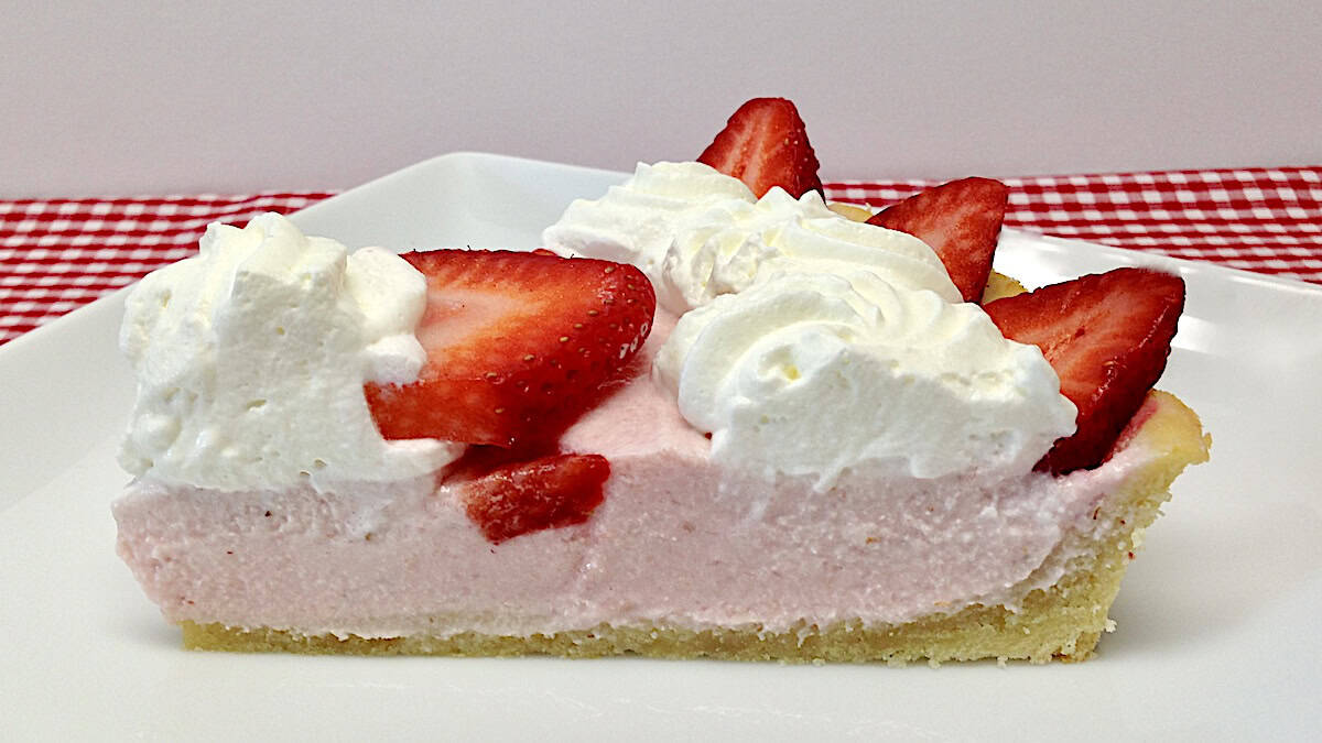 closeup of slice of Strawberry Cream Tart on white plate