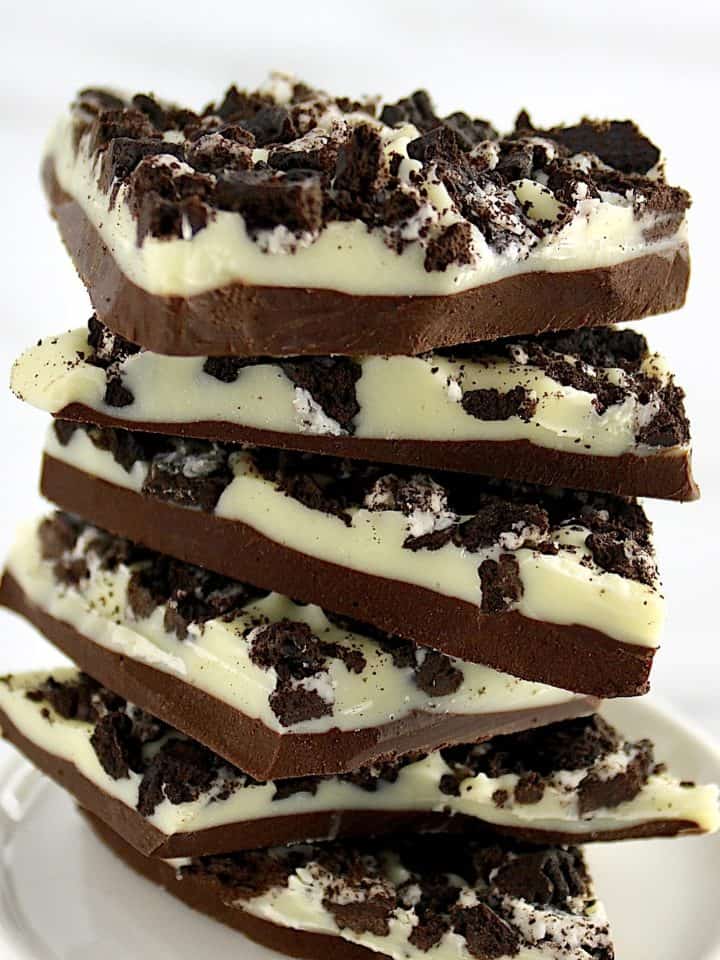 Cookies and Cream Bark pieces stacked up on white plate