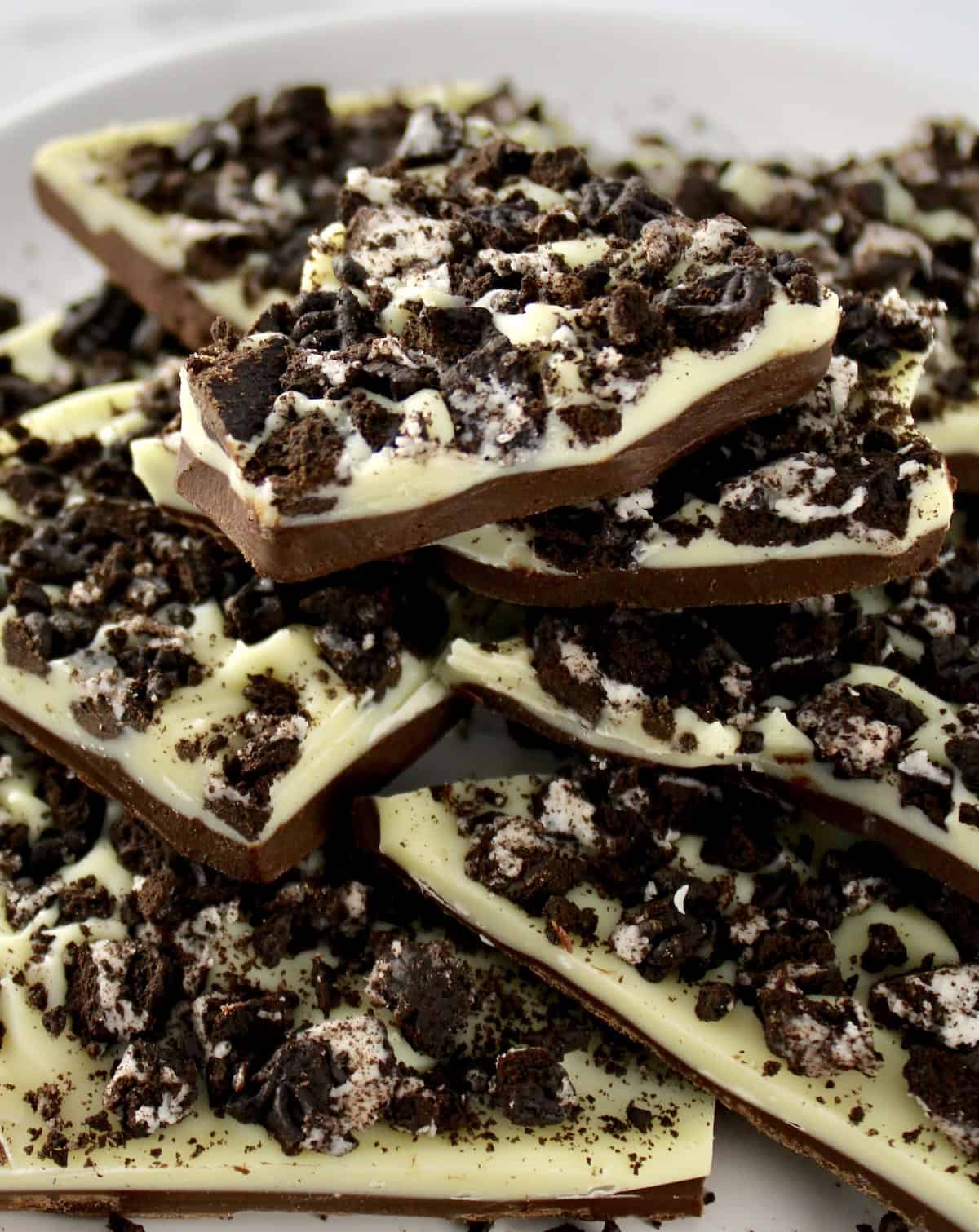 Cookies and Cream Bark stacked up on white plate