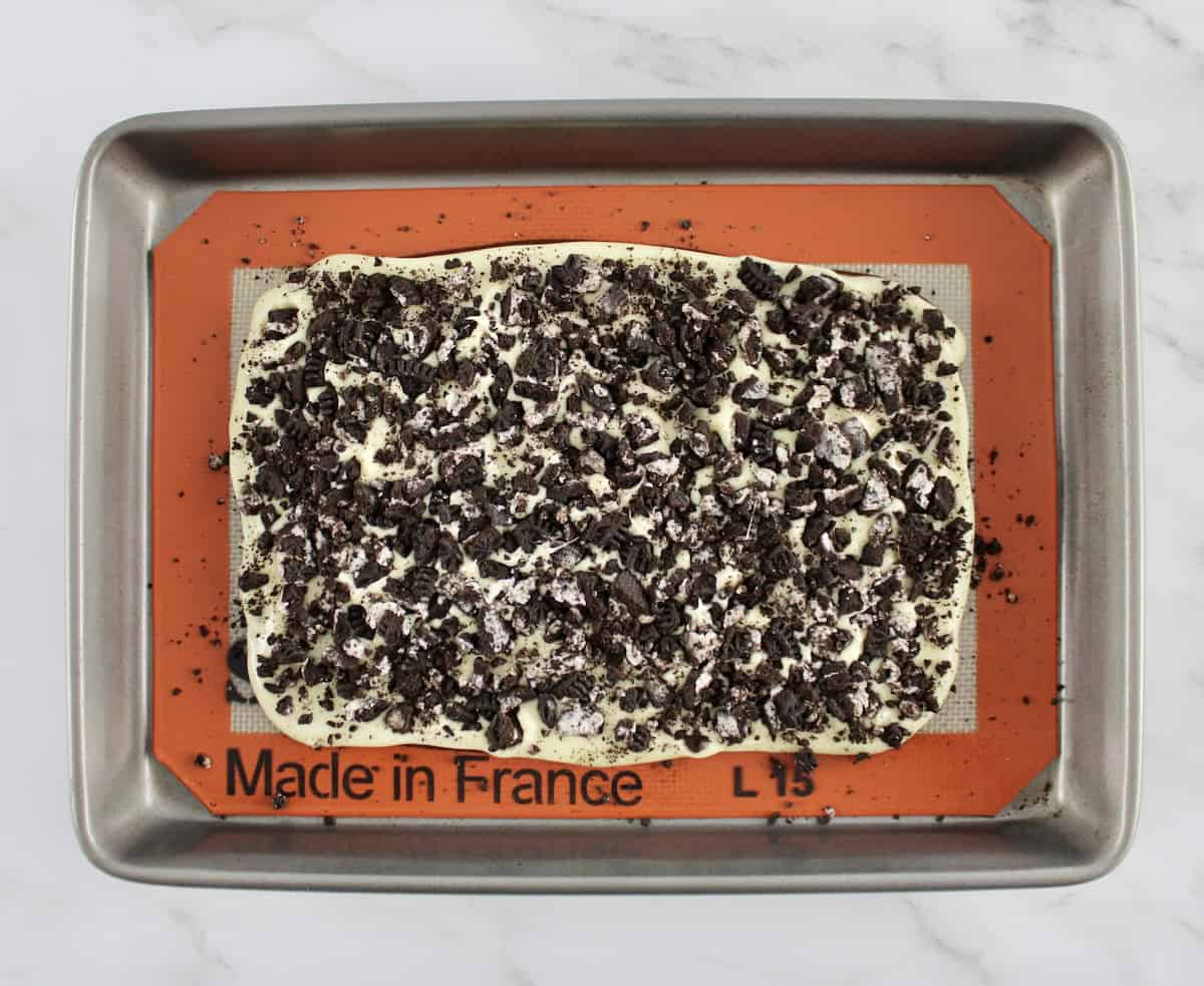 Cookies and Cream Bark on silpat lined baking sheet