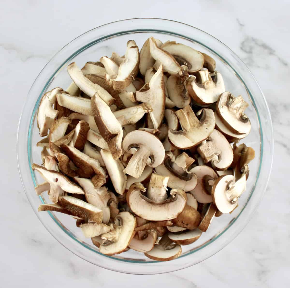 bowl of sliced baby bella and shiitake mushrooms