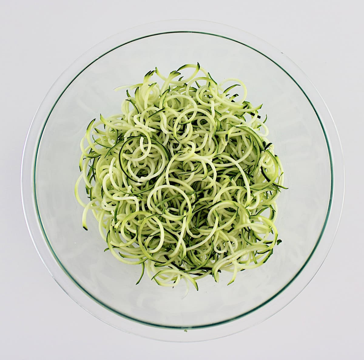 zucchini noodles in glass bowl