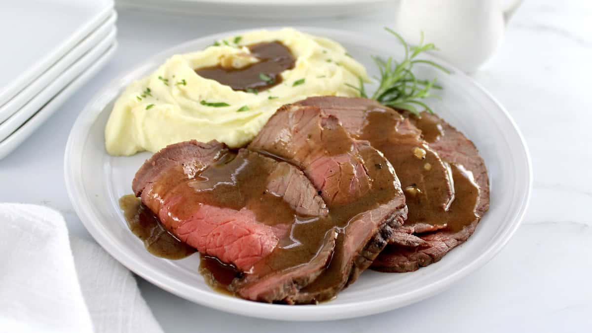 Roast Beef with Gravy on plate with mashed cauliflower and gravy