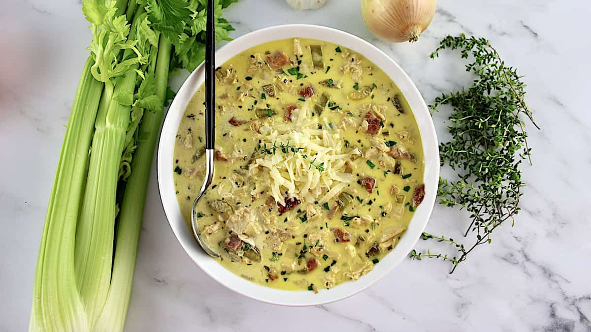 Chicken Cordon Bleu Soup in white bowl with spoon