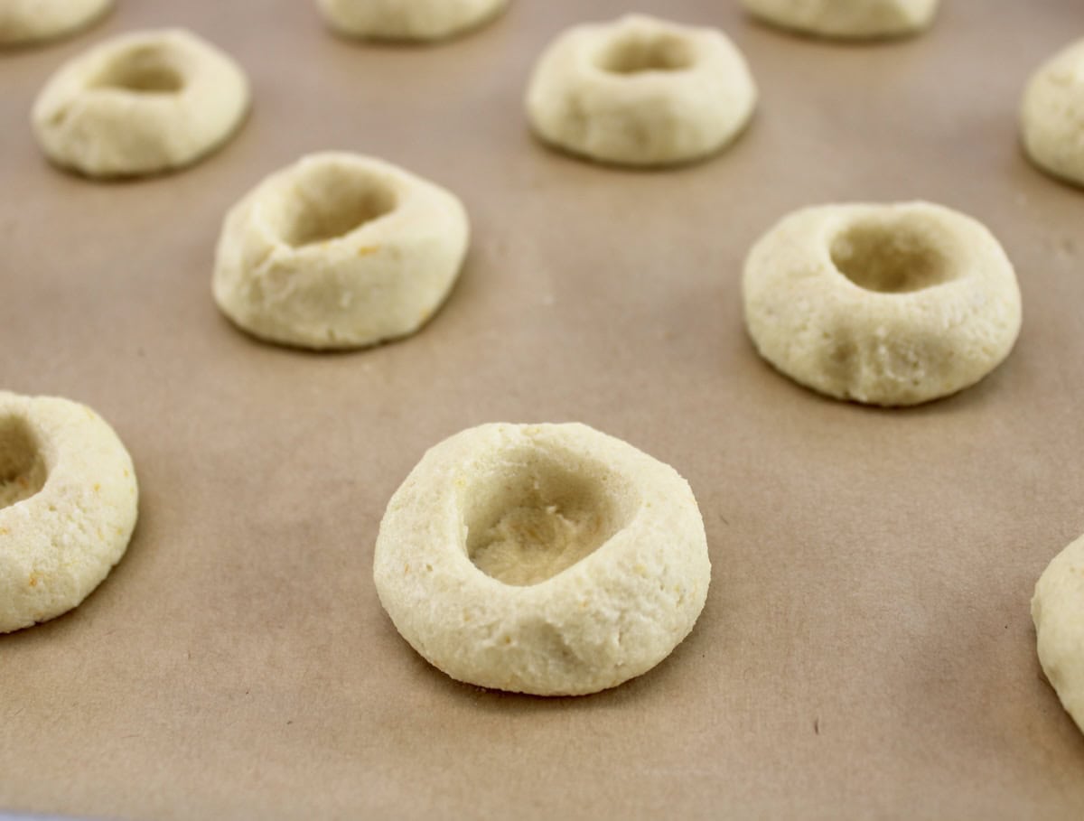 Cranberry Thumbprint Cookies unbaked on parchment paper