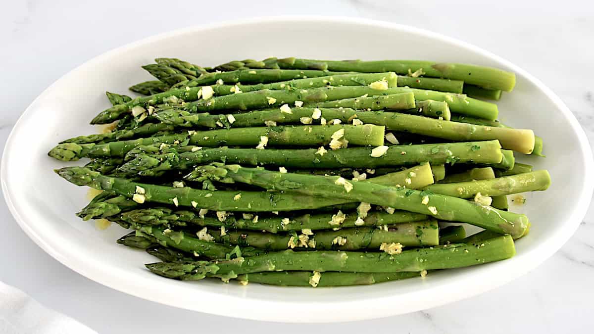 Sautéed Asparagus on white oval plate