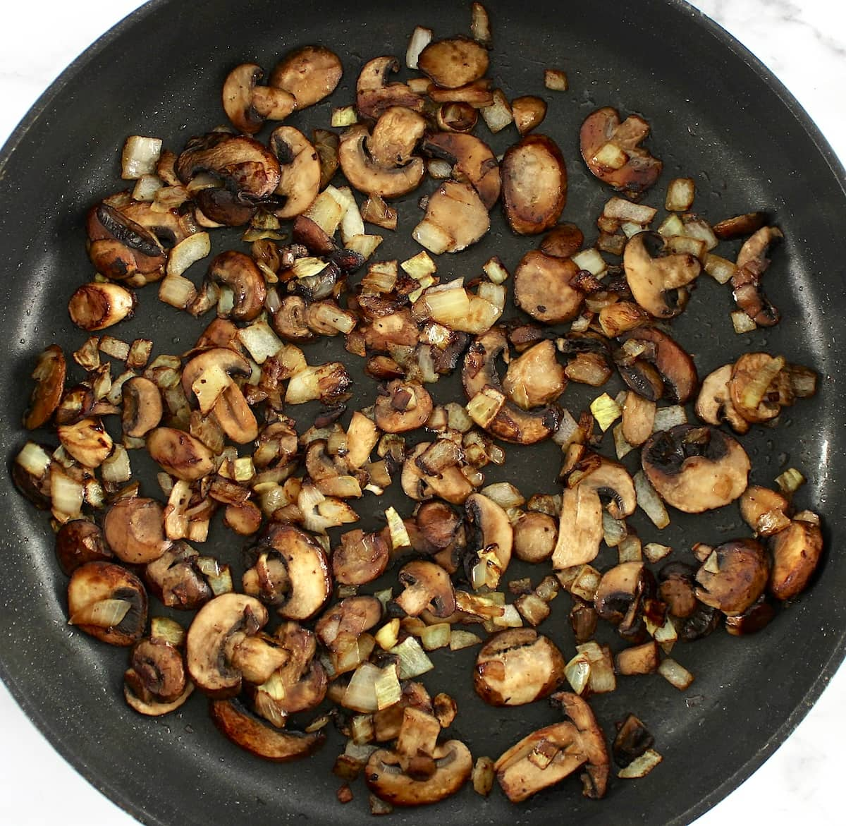 sauteed mushrooms and onions in skillet