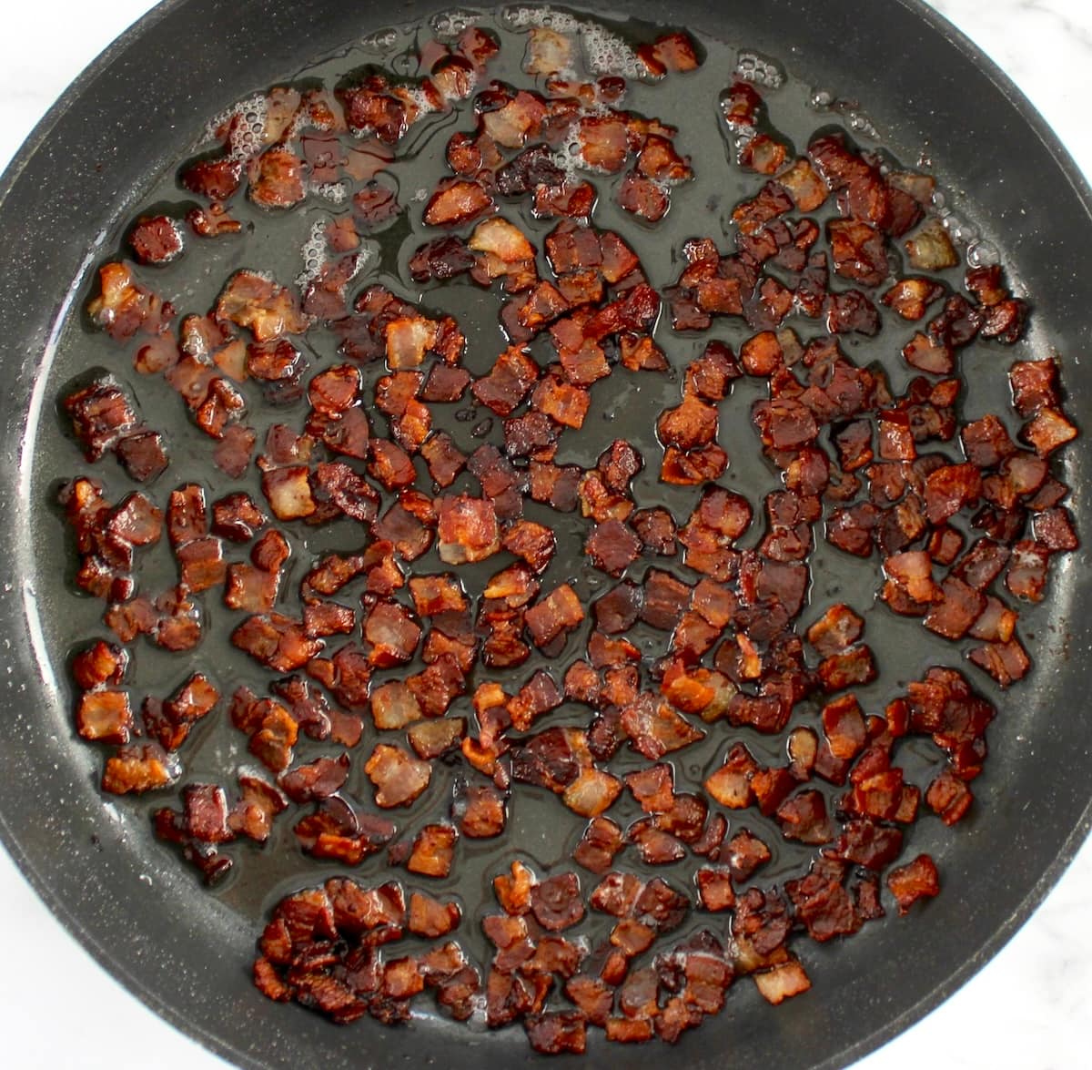 crispy bacon pits fried in skillet