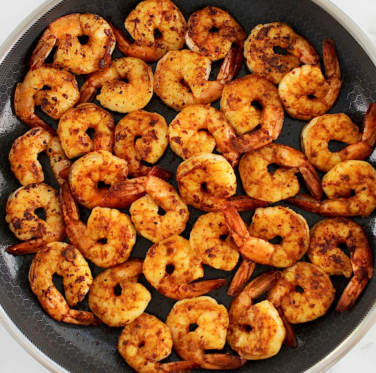 cooked shrimp in skillet with smoked paprika