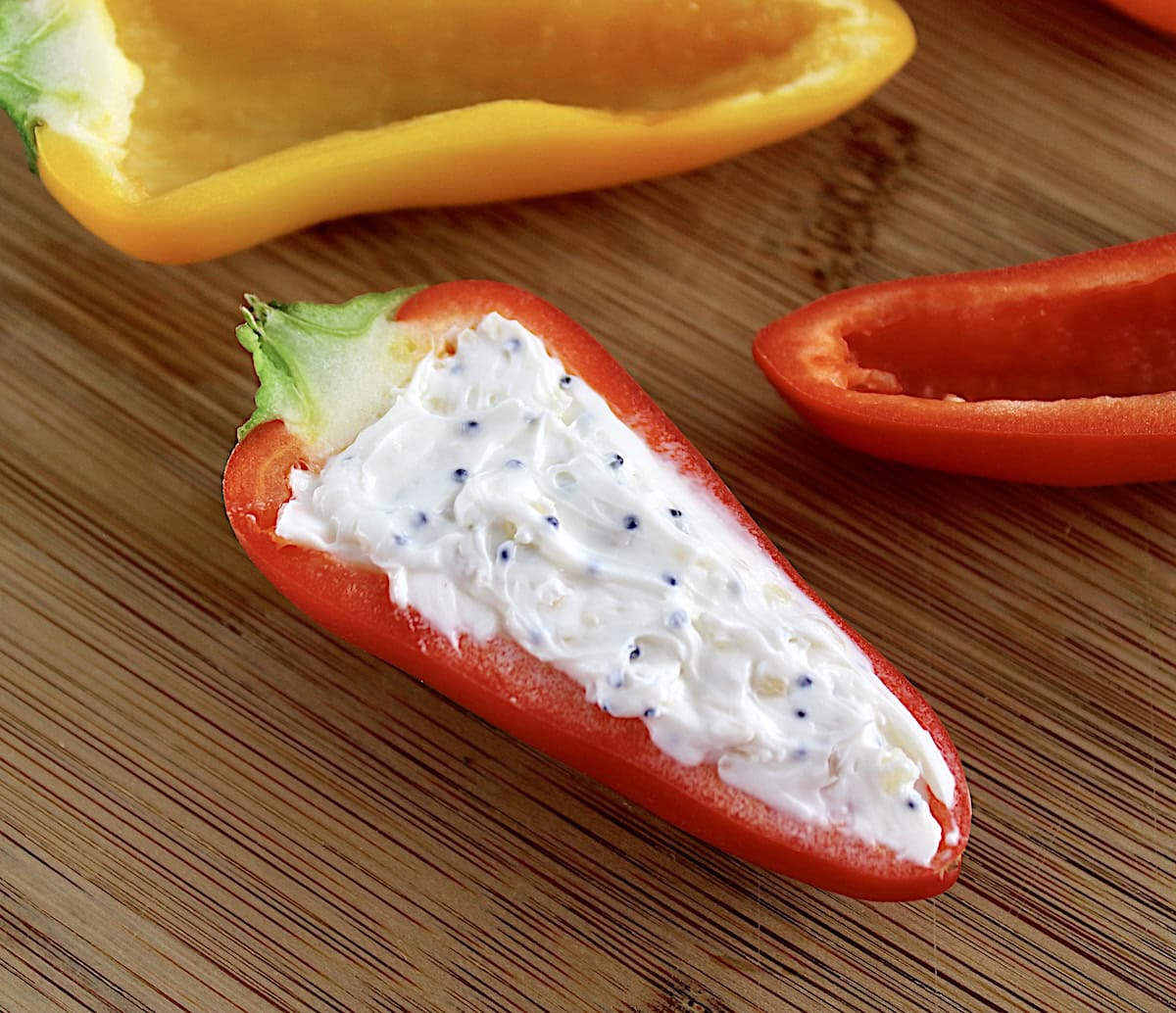 closeup of Everything Bagel Stuffed Mini Pepper on cutting board