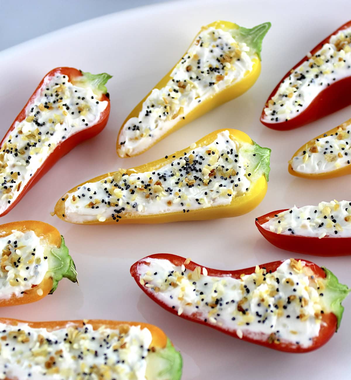 closeup of Everything Bagel Stuffed Mini Peppers on white plate