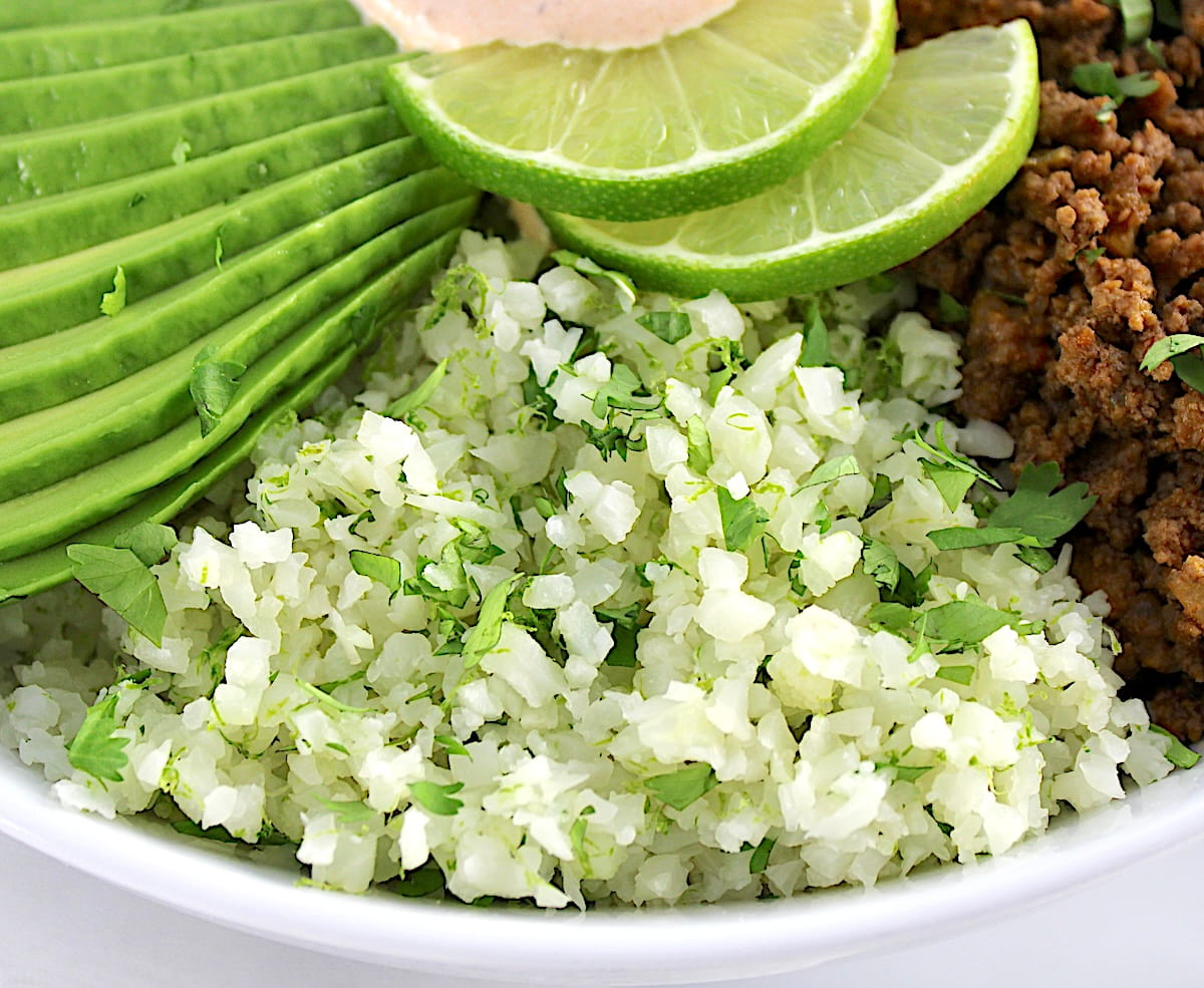 closeup of lime cilantro cauliflower rice in Keto Burrito Bowl