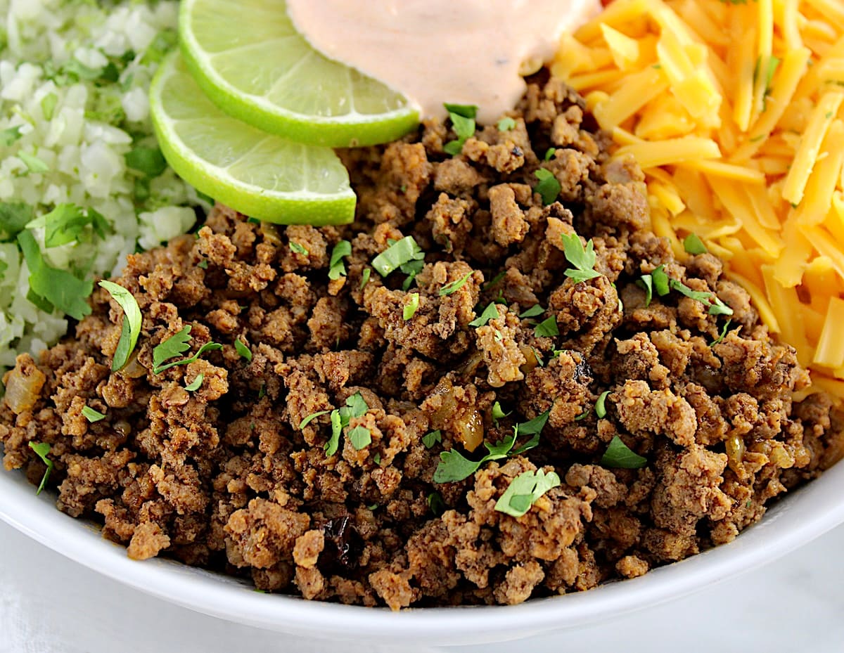 closeup of taco meat in white Burrito Bowl