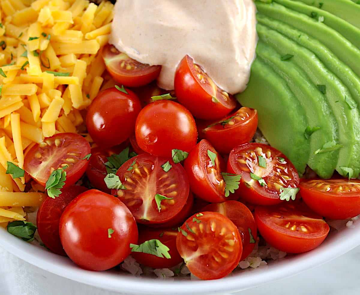 closeup of halved cherry tomatoes in Keto Burrito Bowl