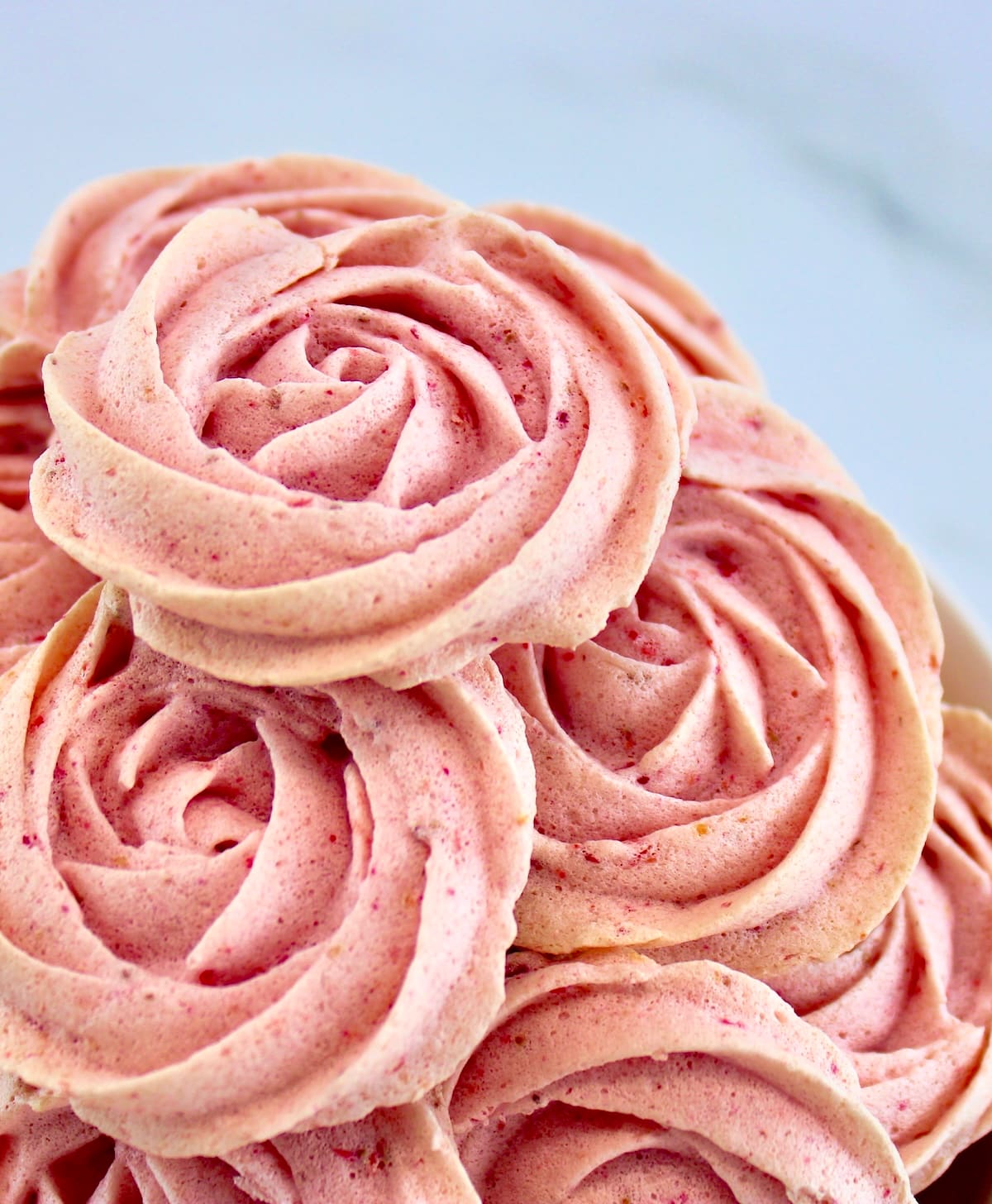 Keto Strawberry Meringue Cookies piled up in white bowl