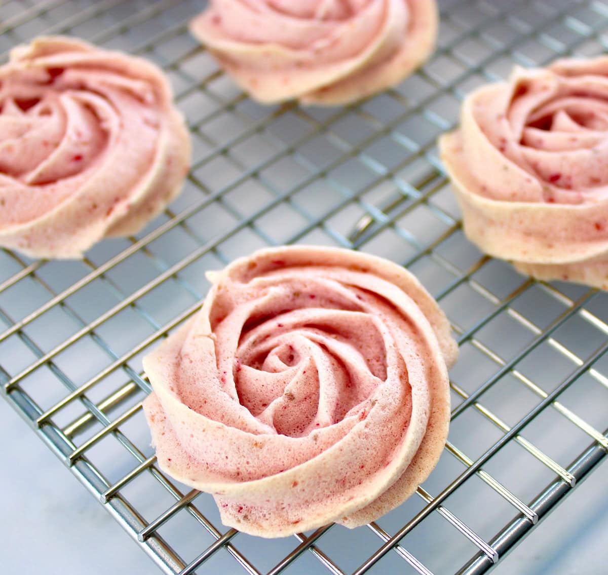 closeup of Keto Strawberry Meringue Cookies on cooling rack