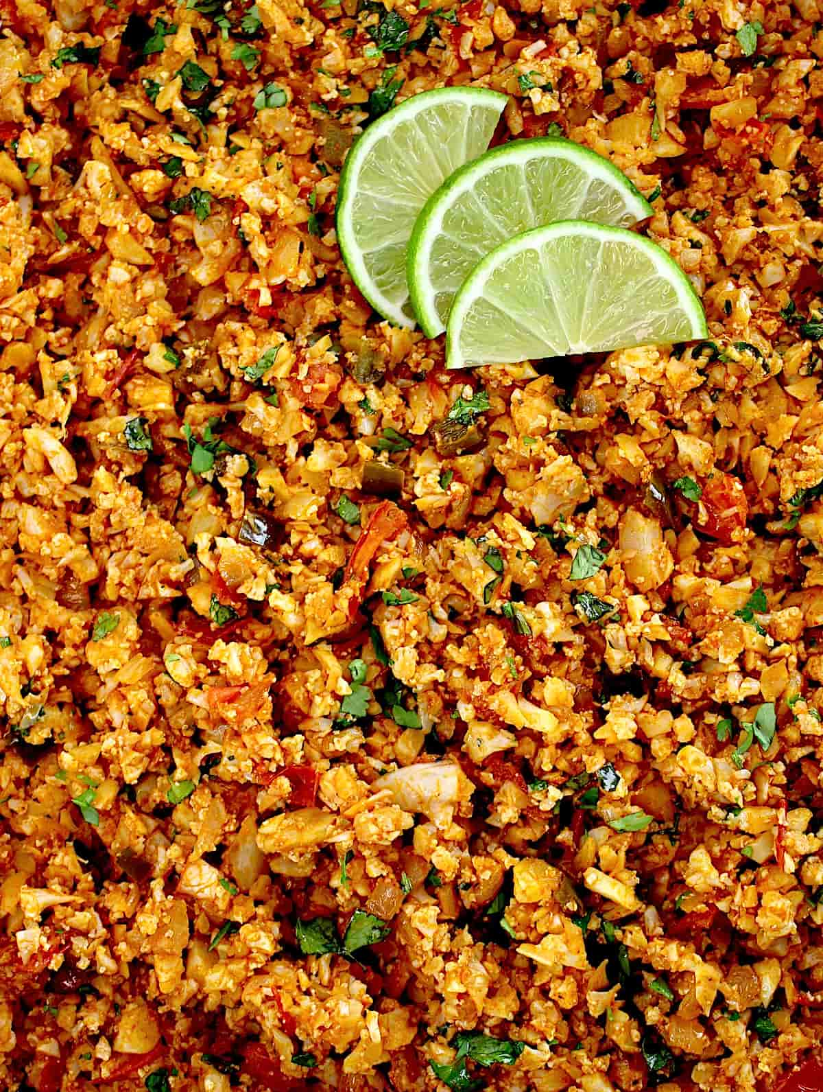 closeup of Mexican Cauliflower Rice with 3 lime slices