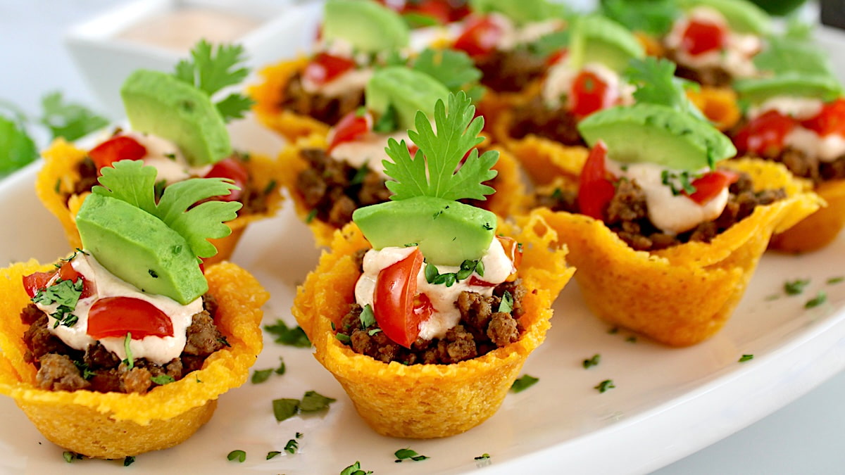 Mini Taco Bites on white platter with cilantro garnish