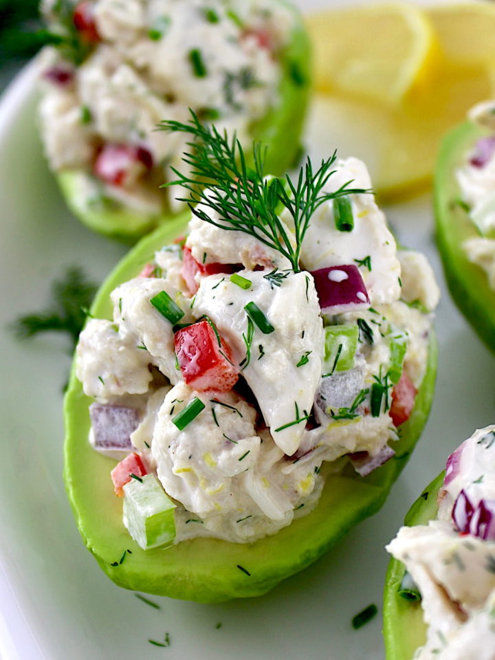 closeup of Crab Salad Stuffed Avocado on white plate