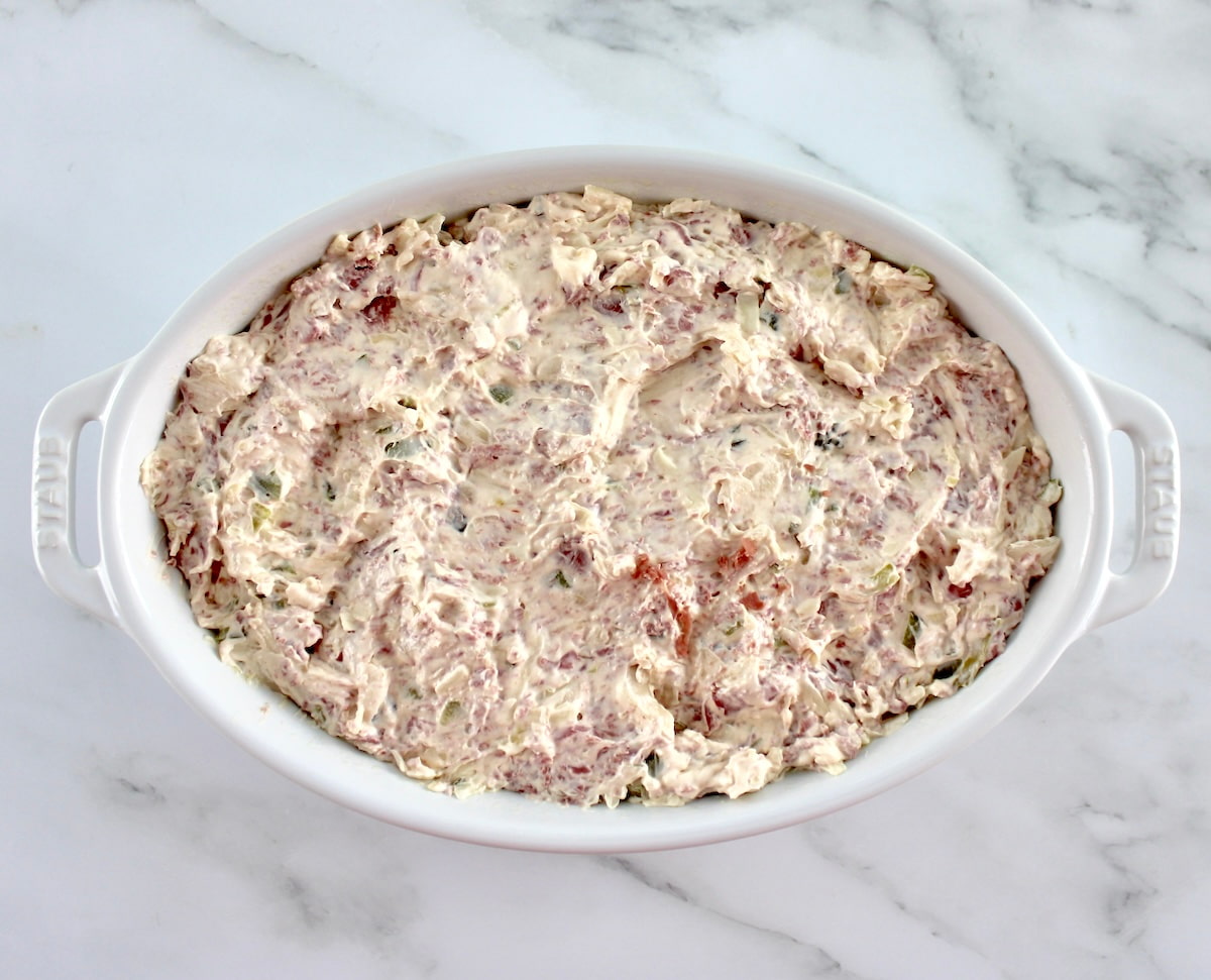 Hot Reuben Dip in white oval casserole unbaked