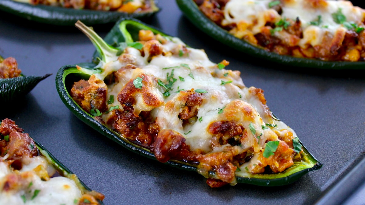 closeup of Stuffed Poblano Peppers on baking sheet