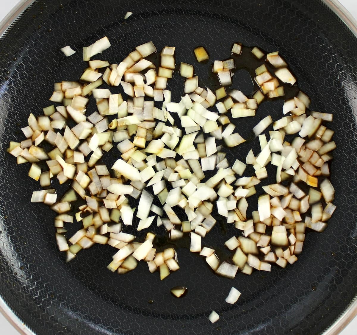 diced onions in skillet