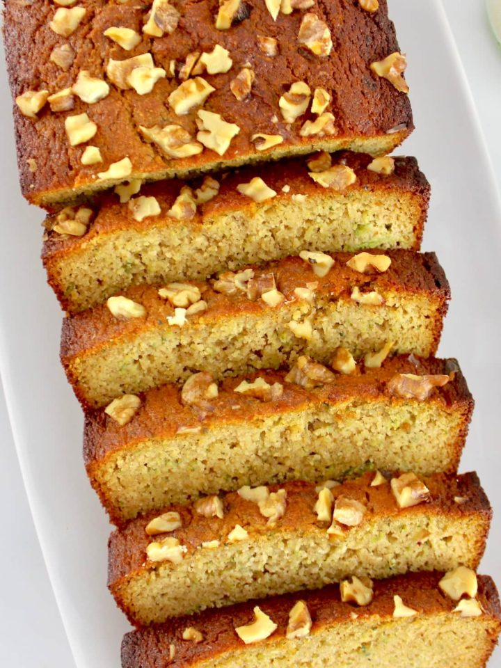 overhead view of Keto Zucchini Bread sliced on white plate
