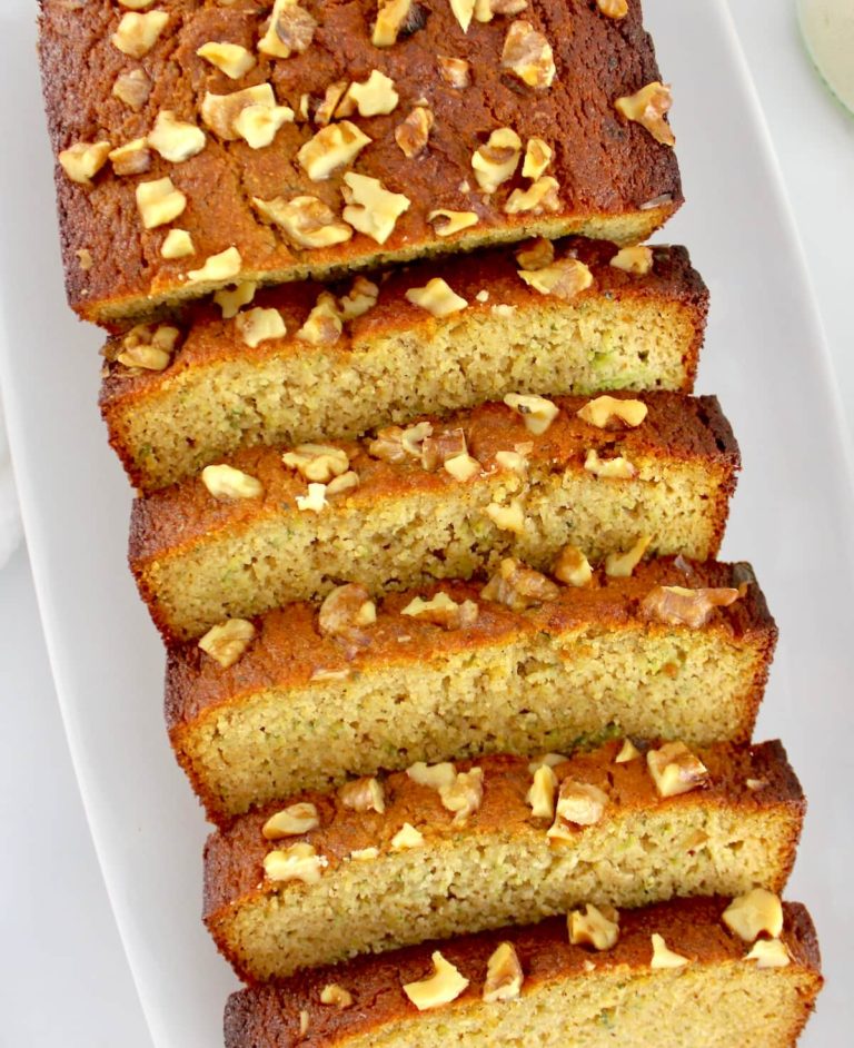 overhead view of Keto Zucchini Bread sliced on white plate