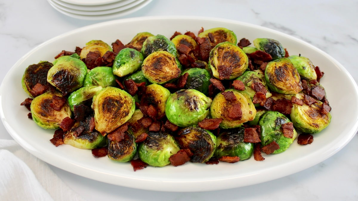 brussels sprouts with bacon on white platter