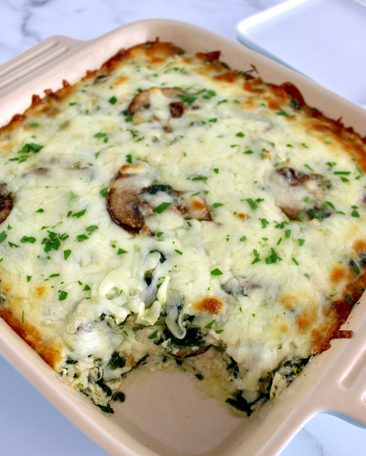 Chicken Alfredo Casserole with piece missing
