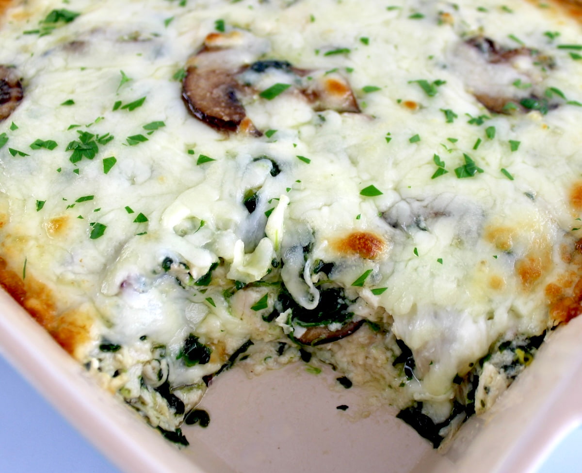 closeup of Chicken Alfredo Casserole with piece missing