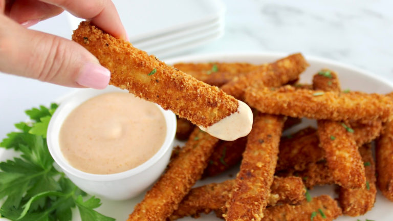 holding up Halloumi Fry that was dipping in sauce