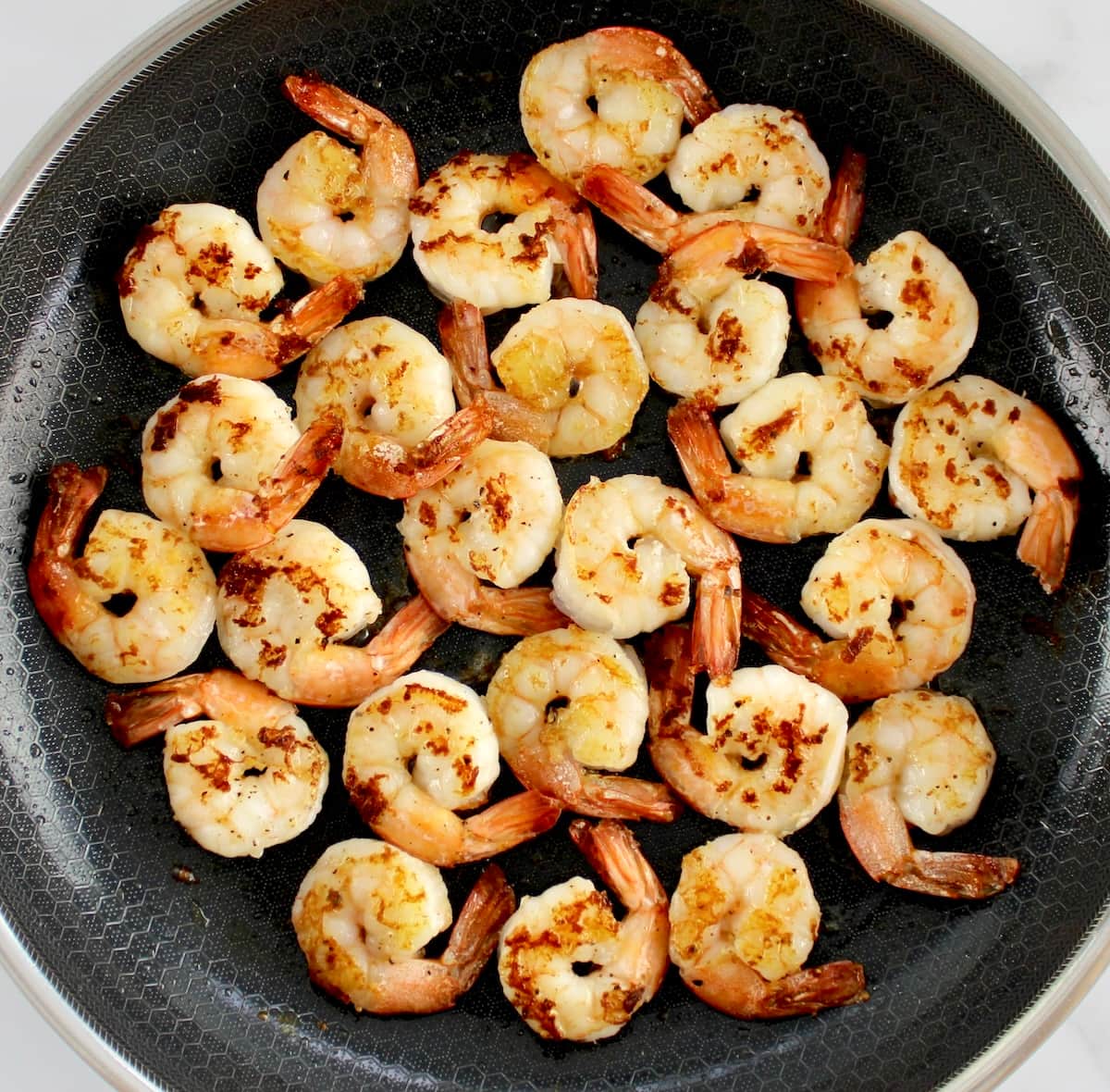 jumbo cooked shrimp in skillet