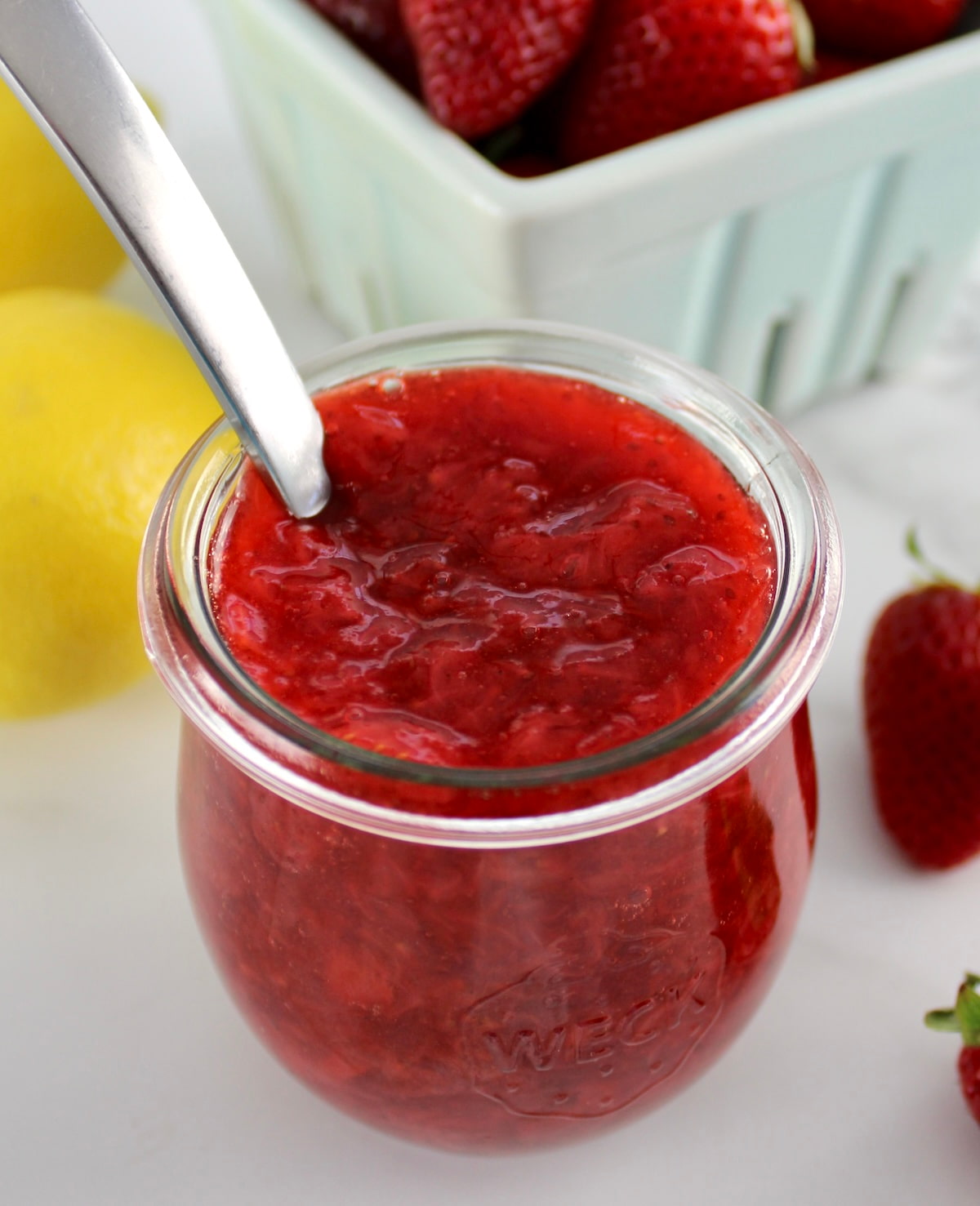 closeup of Keto Strawberry Sauce in open glass jar