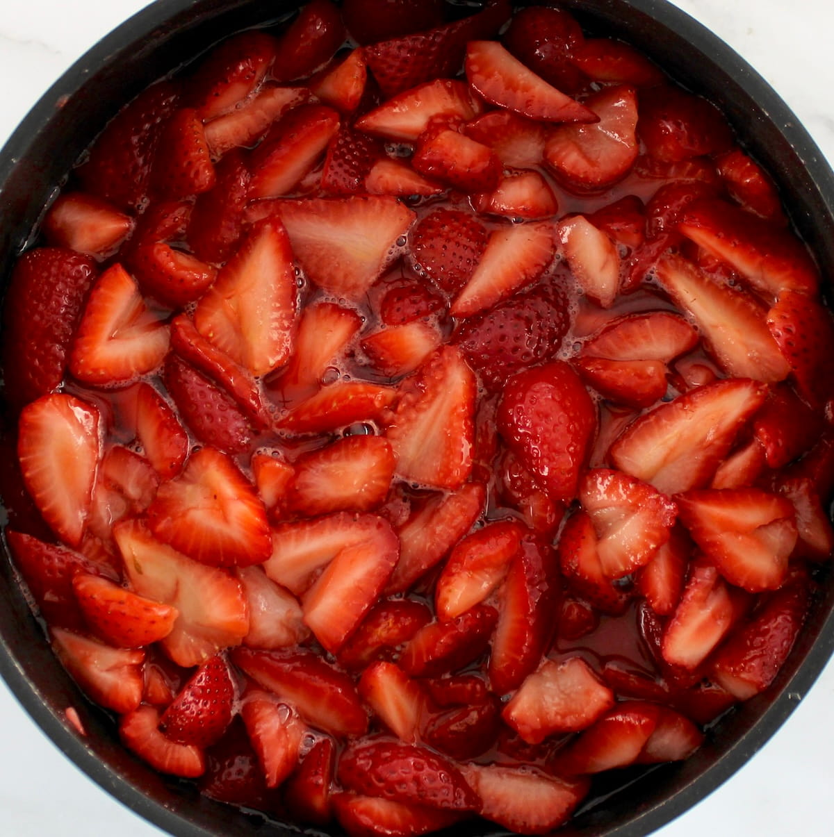 chopped strawberries in saucepan