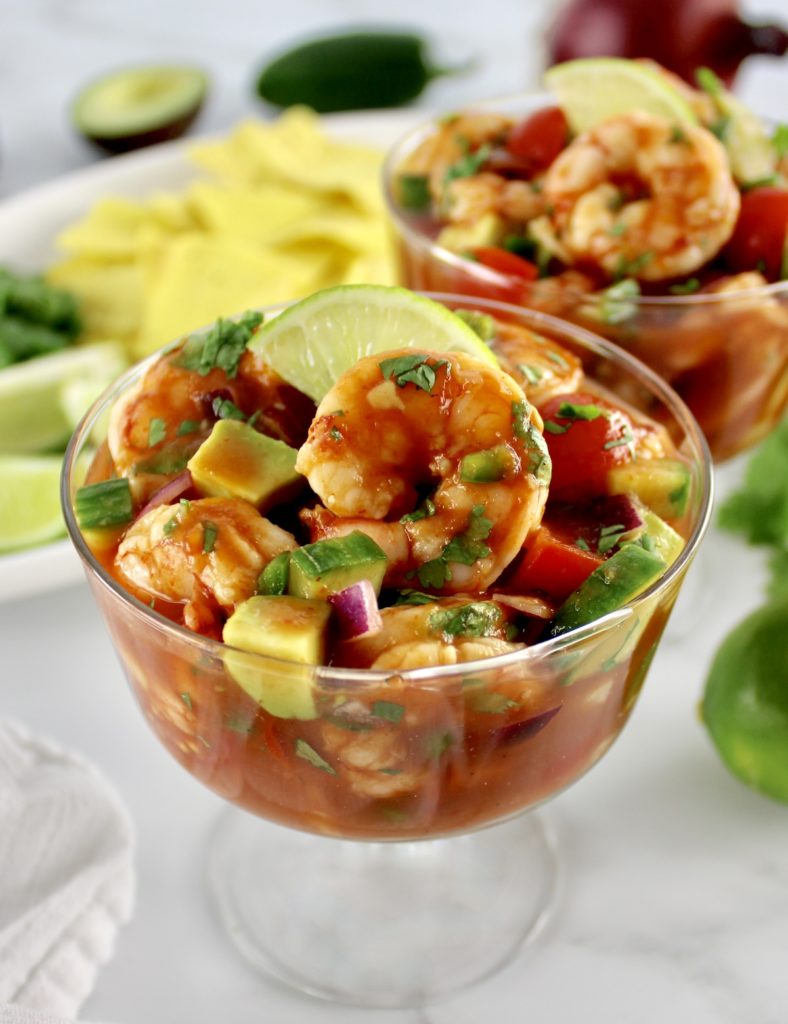 Mexican shrimp cocktail in a glass with lime slice