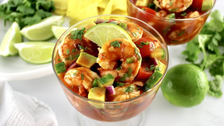 Mexican shrimp cocktail in a glass with lime slice