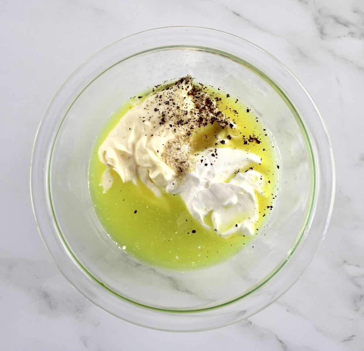 Dill Pickle Coleslaw dressing ingredients in glass bowl unmixed