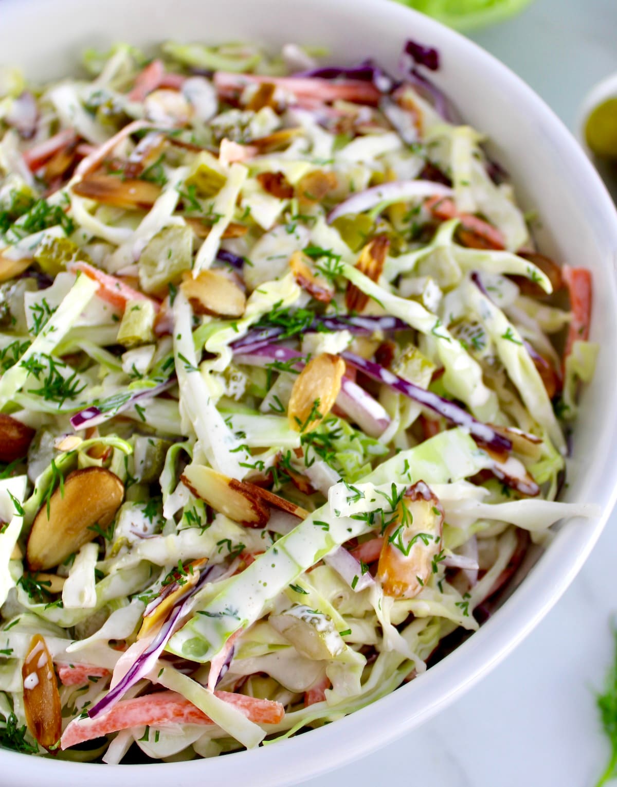 closeup of Dill Pickle Coleslaw in white bowl