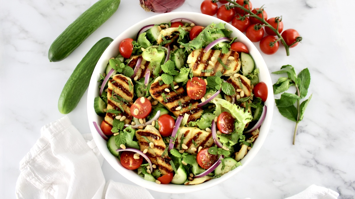 grilled halloumi salad in white bowl
