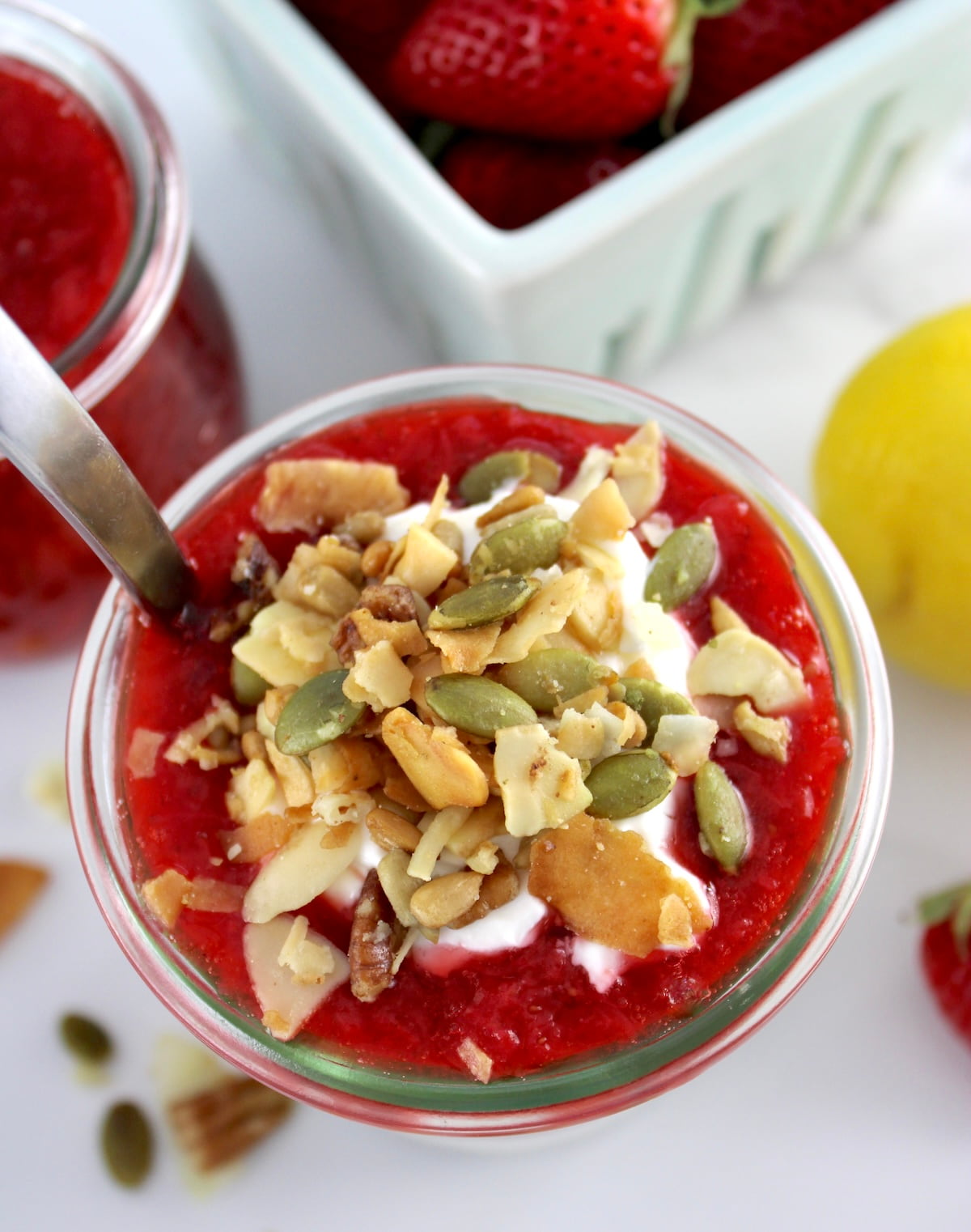overhead view of Keto Strawberry Granola Parfait in open glass jar