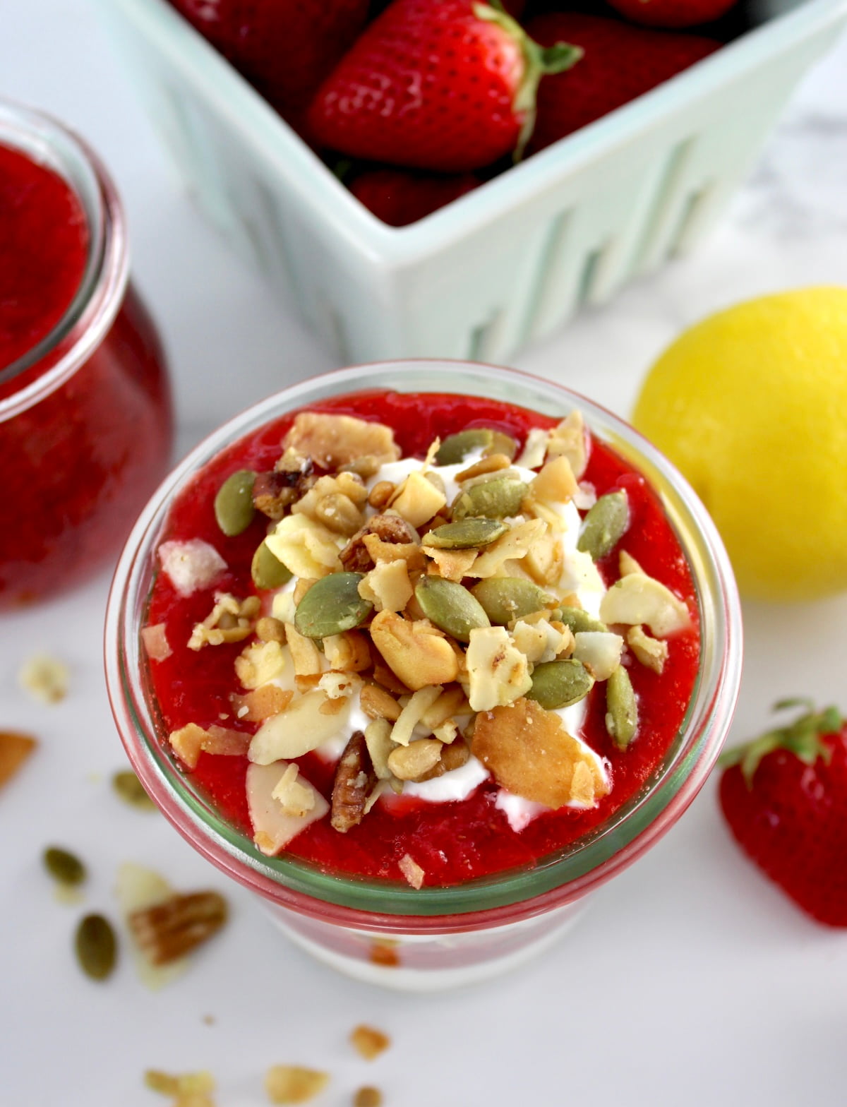 overhead view of Keto Strawberry Granola Parfait in open glass jar