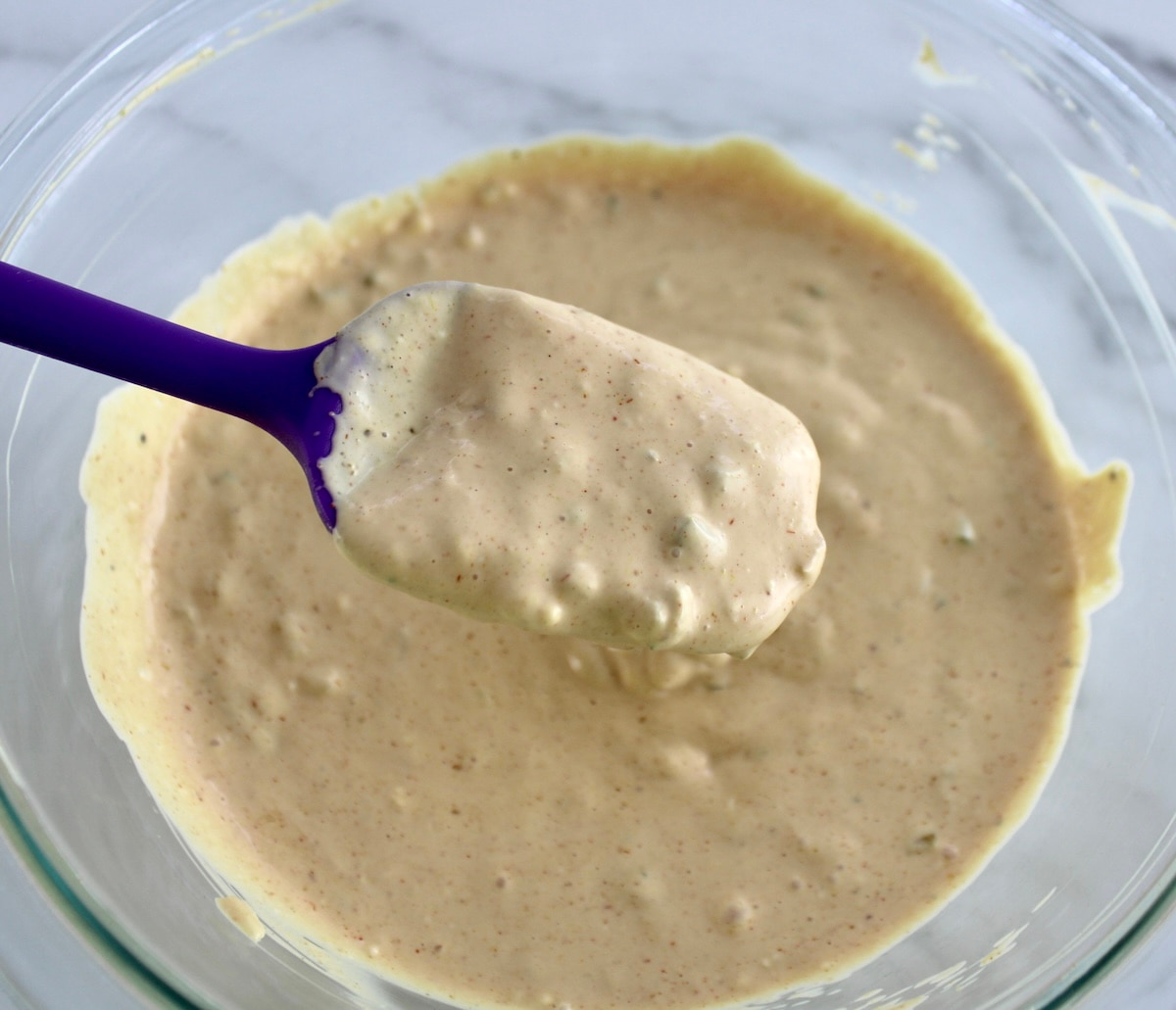 Big Mac Sauce being spooned out of glass bowl