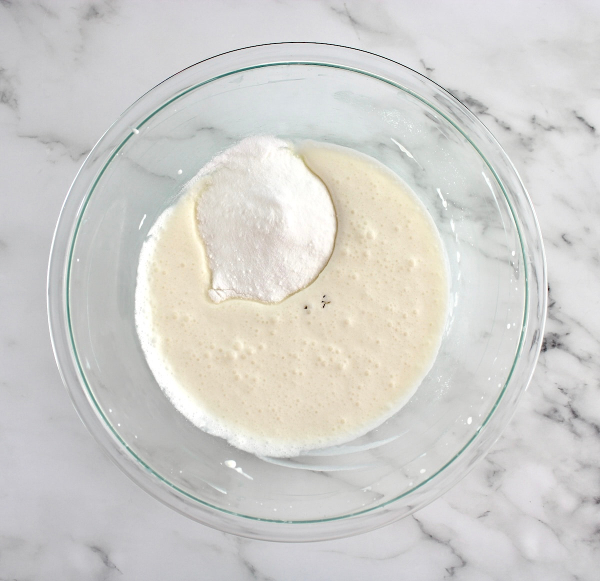 mascarpone cheese, almond milk and sweetener in glass bowl