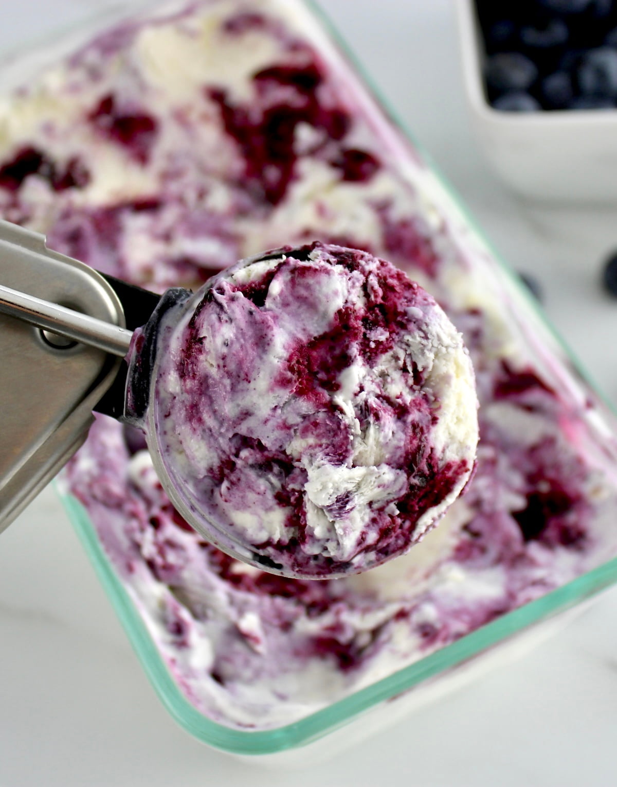 closeup of Blueberry Vanilla Swirl Ice Cream in ice cream scoop