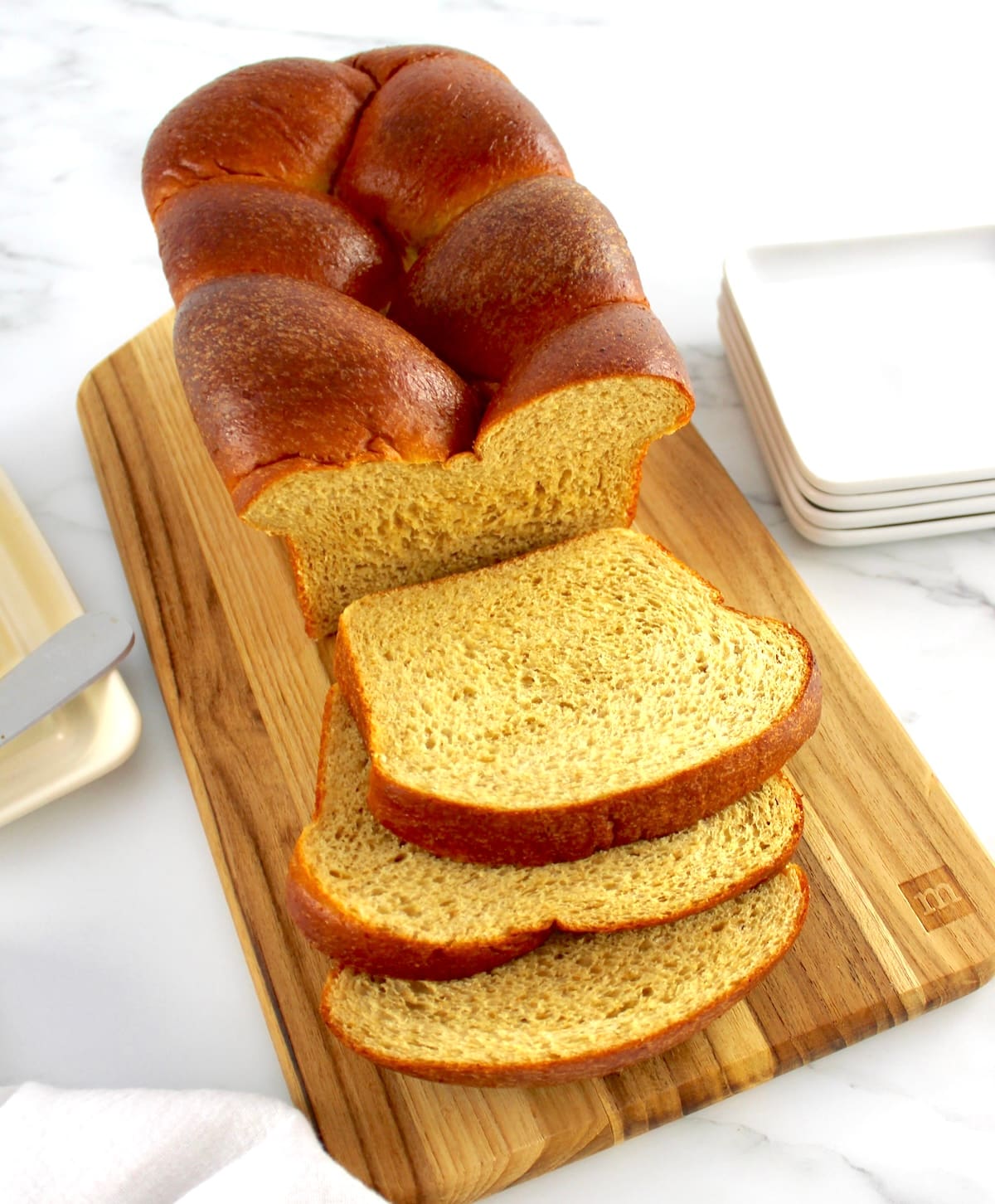 Keto Brioche Bread on cutting board with a few slices
