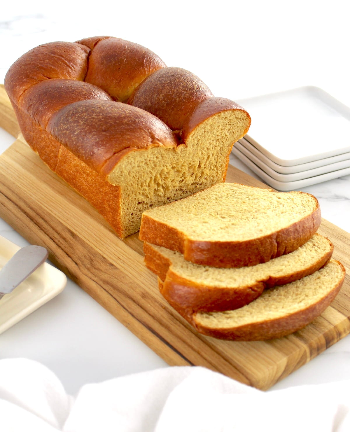 Keto Brioche Bread on cutting board with a few slices