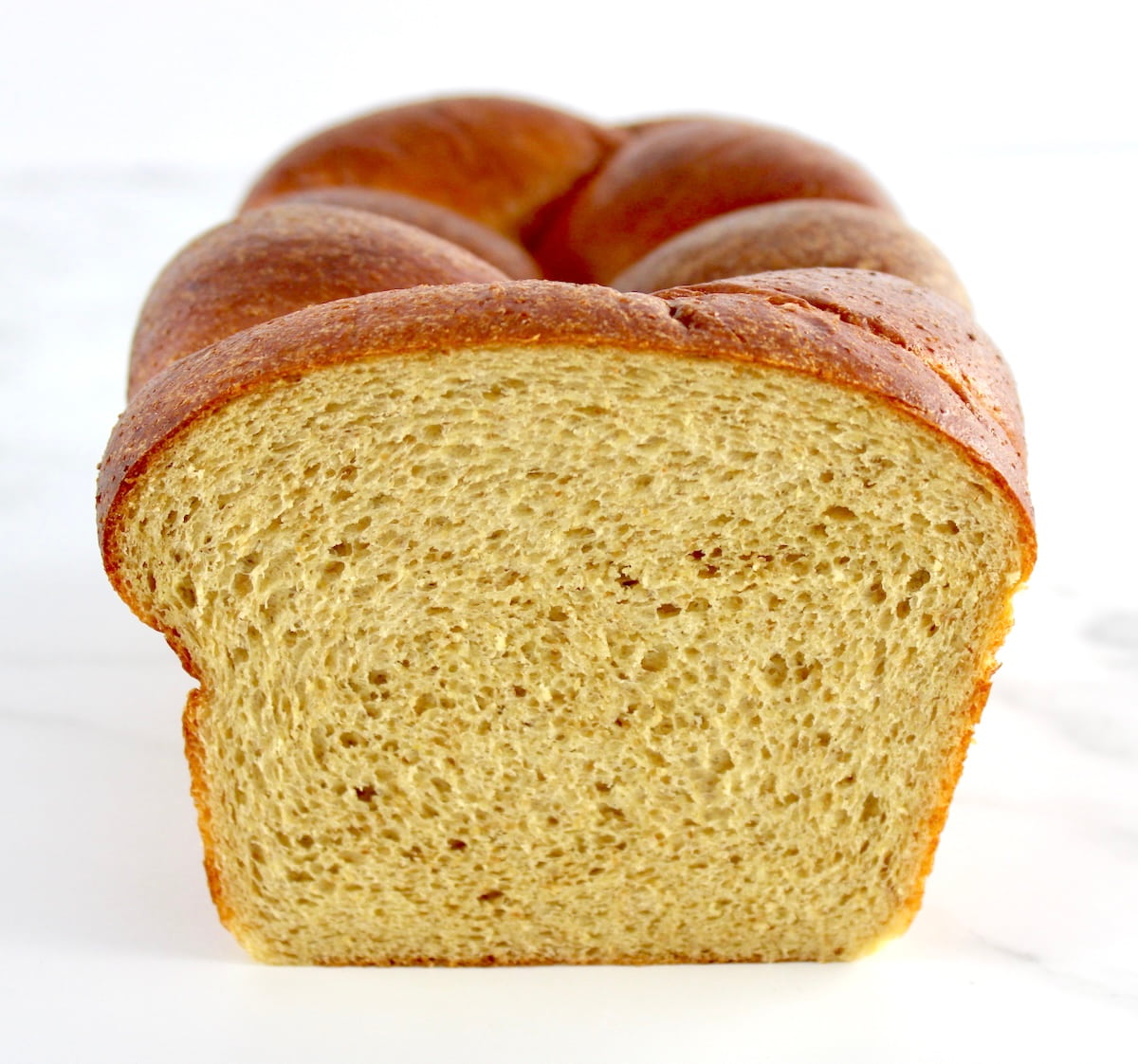 closeup front view of Keto Brioche Bread with slice missing