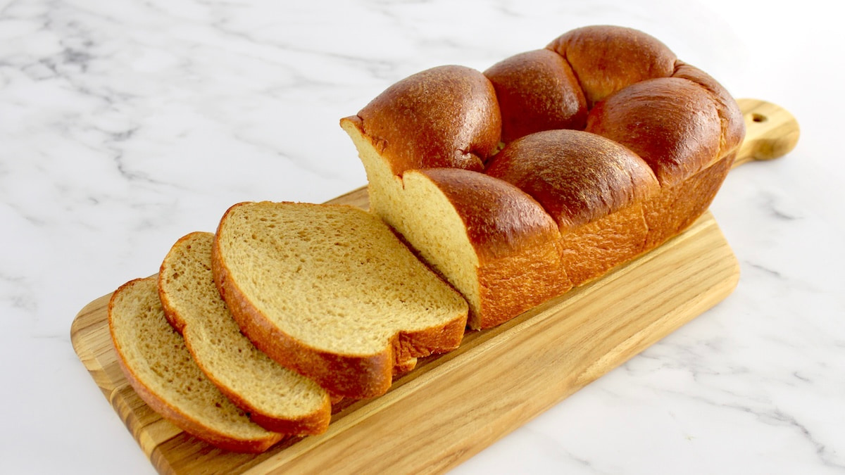 Keto Brioche Bread on cutting board with a few slices