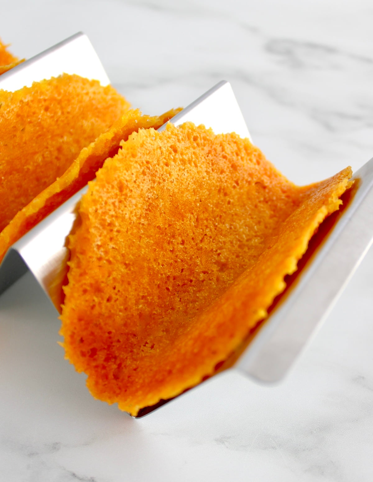 Keto Cheese Taco Shells in metal taco holder